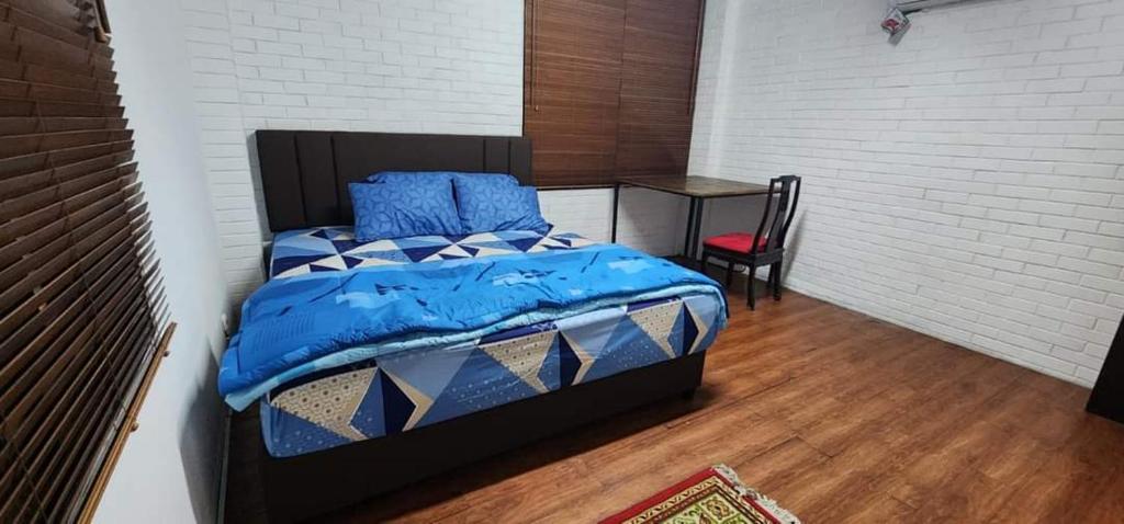 Postel nebo postele na pokoji v ubytování Mayestik Guest House Syariah