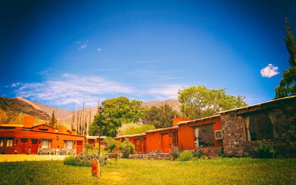 a fire hydrant in front of a group of buildings at Huaira Huasi in Purmamarca