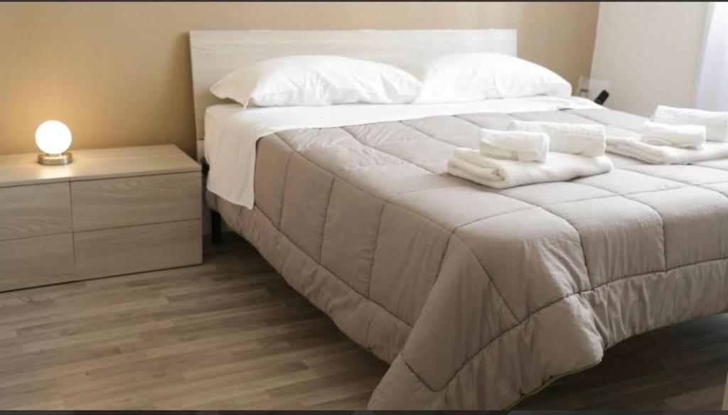 Postel nebo postele na pokoji v ubytování Reggio Centro B&B