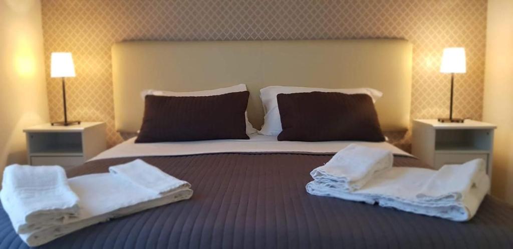 Postel nebo postele na pokoji v ubytování Reggio Centro B&B