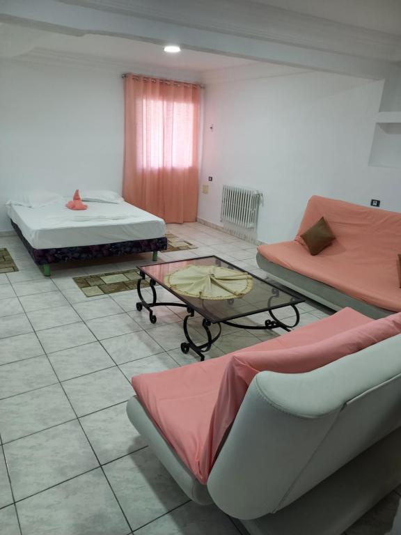 Postel nebo postele na pokoji v ubytování Hotel Le Khalife