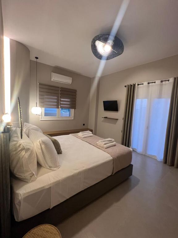 Postel nebo postele na pokoji v ubytování Munda suites