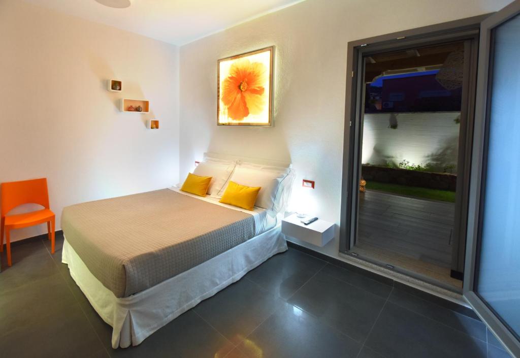 Postel nebo postele na pokoji v ubytování Elis b&b Villasimius