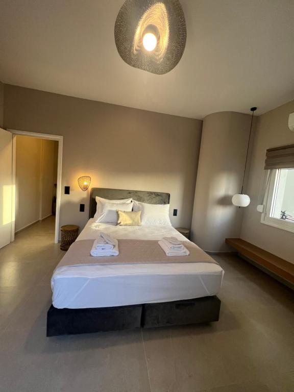 Postel nebo postele na pokoji v ubytování Munda suites