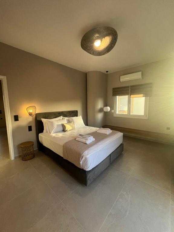 Postel nebo postele na pokoji v ubytování Munda suites