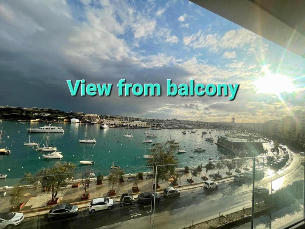 a view of a harbor with boats in the water at Seaview Serenity 3-Bedroom Apt view over Valletta Harbour in Sliema