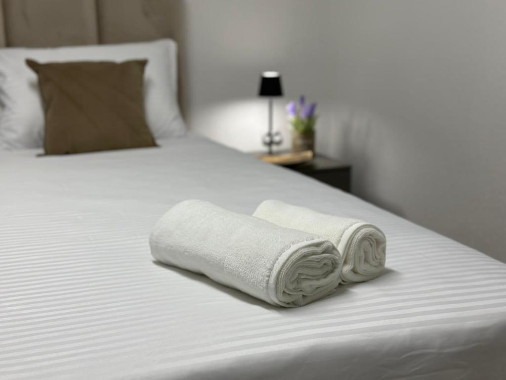 Postel nebo postele na pokoji v ubytování Next Rooms
