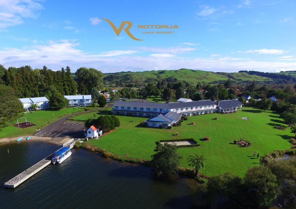 an aerial view of a house on a island in the water at VR Rotorua Lake Resort in Rotorua