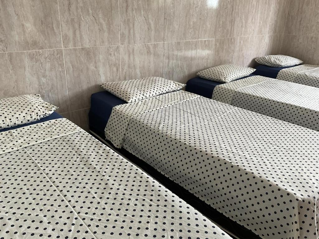 Postel nebo postele na pokoji v ubytování Pousada Pitanga