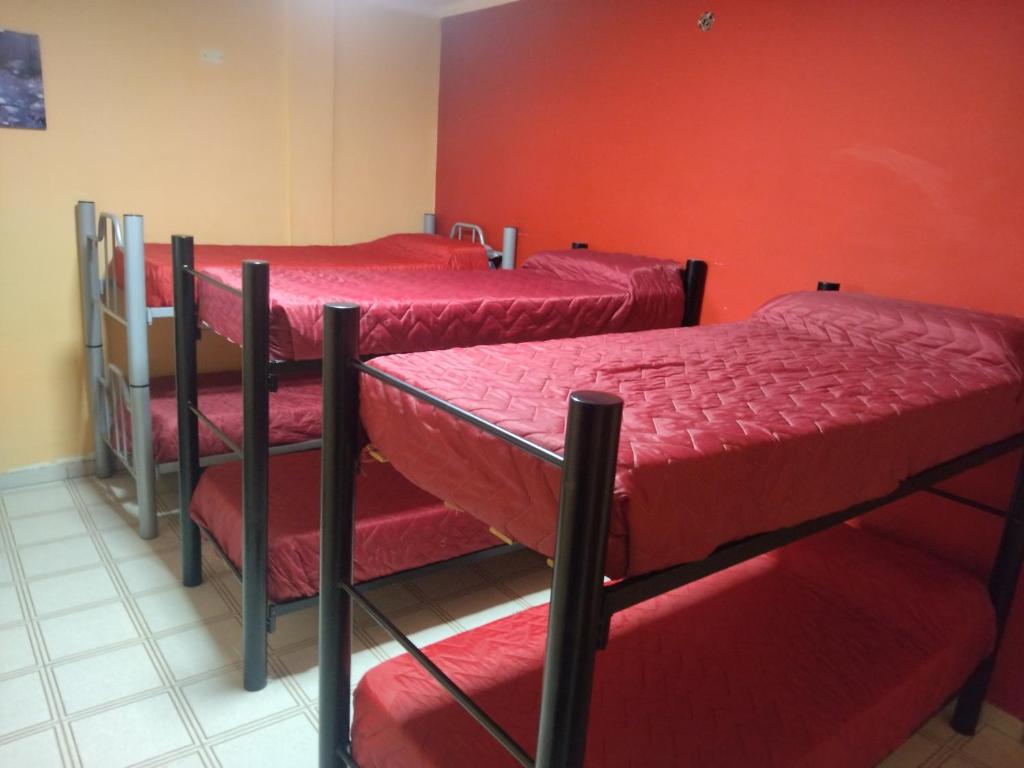 Krevet ili kreveti na kat u jedinici u objektu Hostal Lo de Ramona