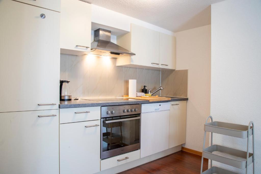 A cozinha ou kitchenette de Nimbuzzz Apartments