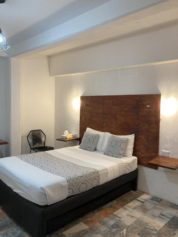 Postel nebo postele na pokoji v ubytování Hotel Boutique Ixaya