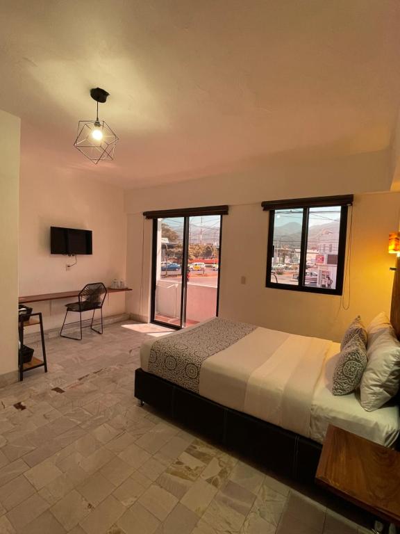 TV a/nebo společenská místnost v ubytování Hotel Boutique Ixaya