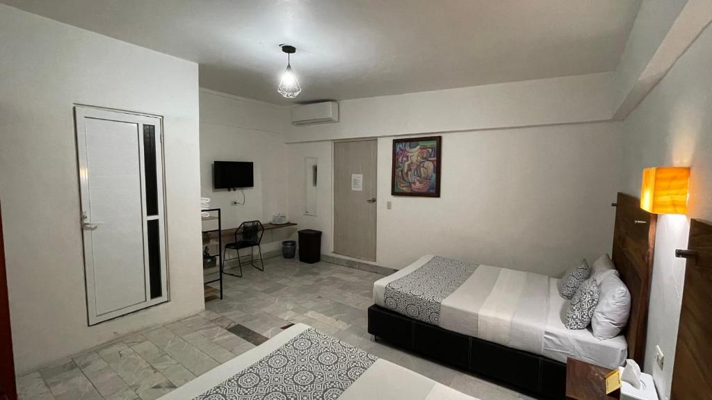 Postel nebo postele na pokoji v ubytování Hotel Boutique Ixaya