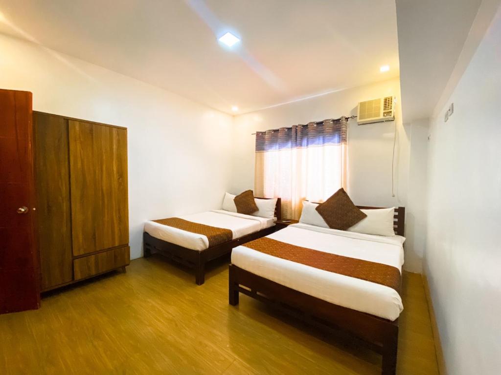 Postel nebo postele na pokoji v ubytování Hortz Hotels And Resorts