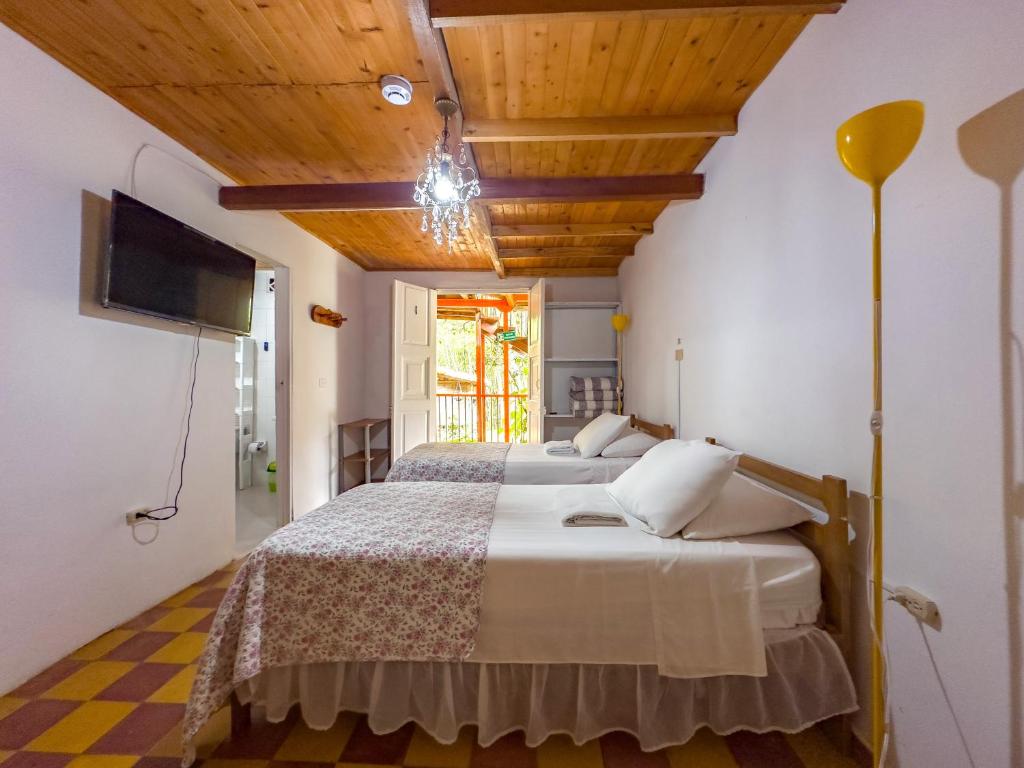 Postel nebo postele na pokoji v ubytování Kantarrana Casa de Campo