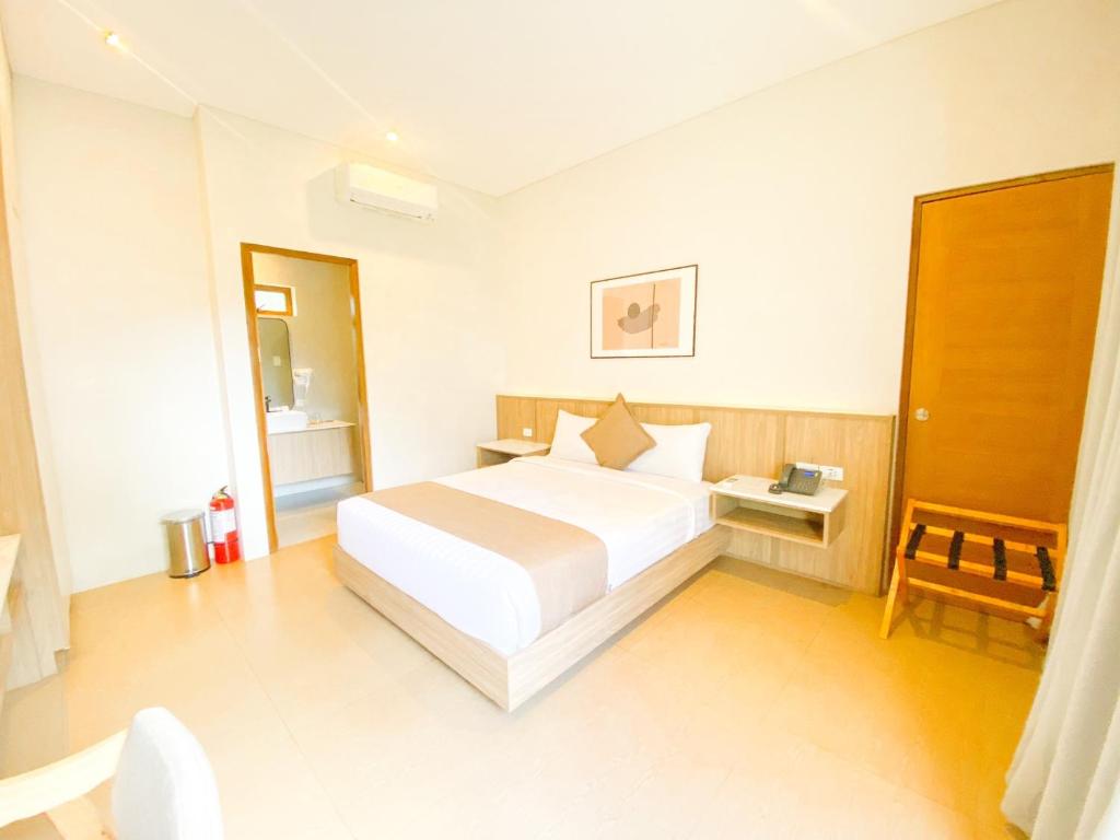 Postel nebo postele na pokoji v ubytování Hortz Hotels And Resorts