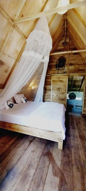 Cama o camas de una habitación en Girang Rinjani Bungalows