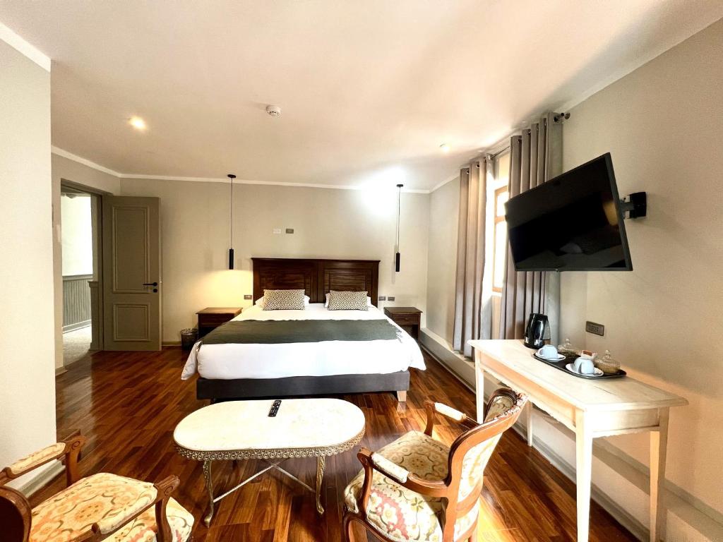 TV a/nebo společenská místnost v ubytování Hotel Montes Central
