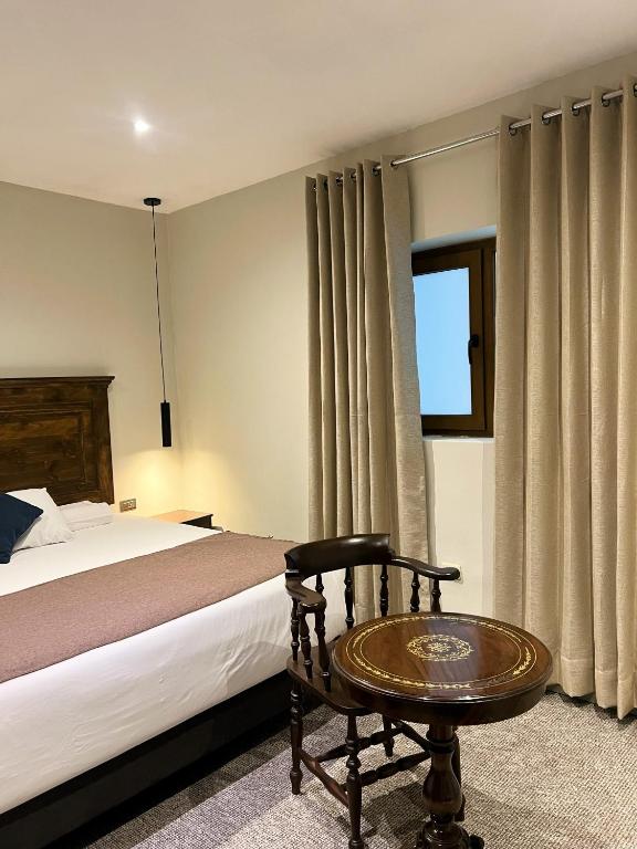 Postel nebo postele na pokoji v ubytování Hotel Montes Central