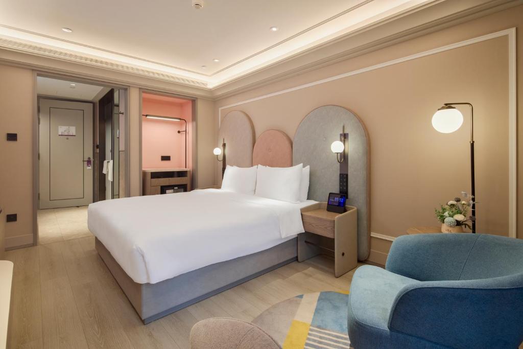 Postel nebo postele na pokoji v ubytování Mercure Xian Dazhai Road