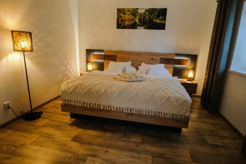 Postel nebo postele na pokoji v ubytování APARTMÁN ZLATÝ DUB