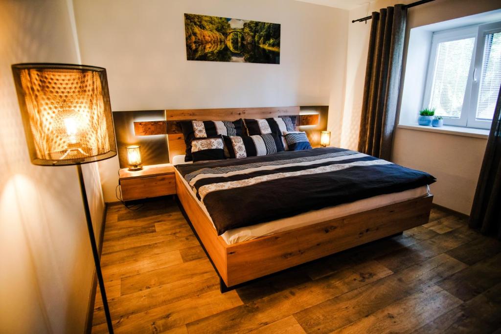 Postel nebo postele na pokoji v ubytování APARTMÁN ZLATÝ DUB