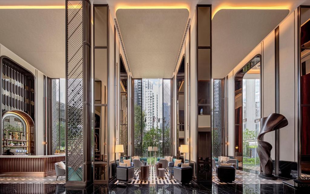 a lobby with a view of a city at InterContinental Bangkok Sukhumvit, an IHG Hotel in Bangkok