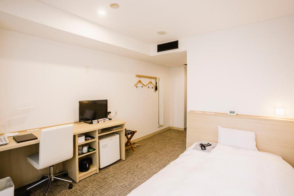 TV a/nebo společenská místnost v ubytování HOTEL　KAMO