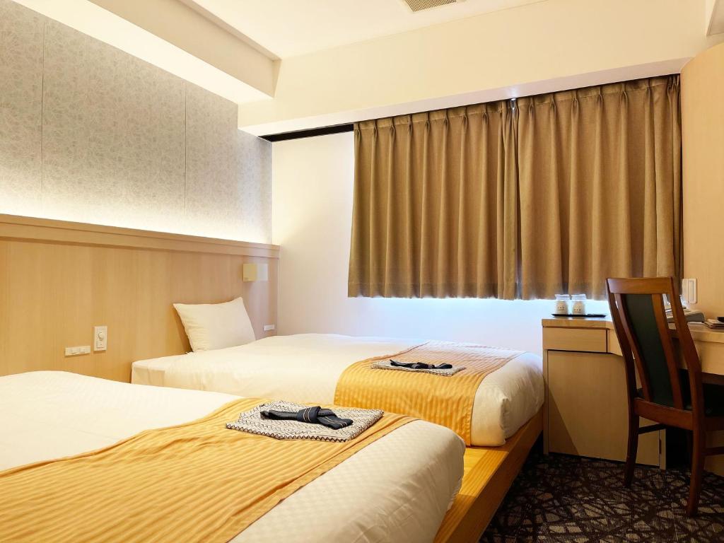 Postel nebo postele na pokoji v ubytování HOTEL　KAMO