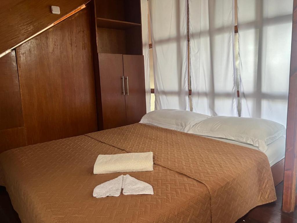 Postel nebo postele na pokoji v ubytování Orokasa Guesthouse