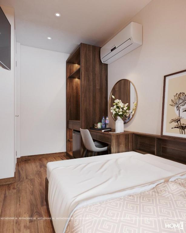 Postel nebo postele na pokoji v ubytování The Cosy Inn Hanoi