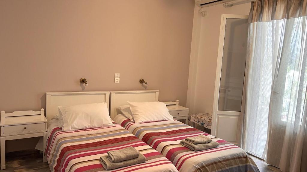 Postel nebo postele na pokoji v ubytování Marisa Rooms