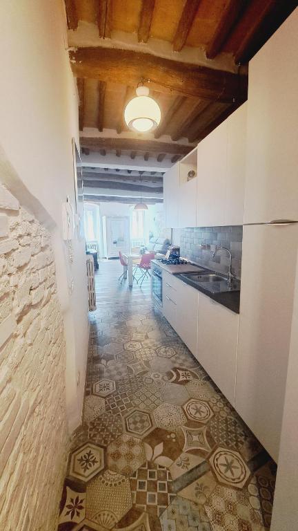 A kitchen or kitchenette at La Scalinata Apartment