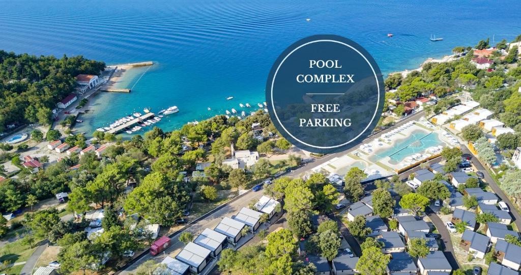an aerial view of a resort with a free parking sign at Elements Camping Selce Mobile homes in Selce
