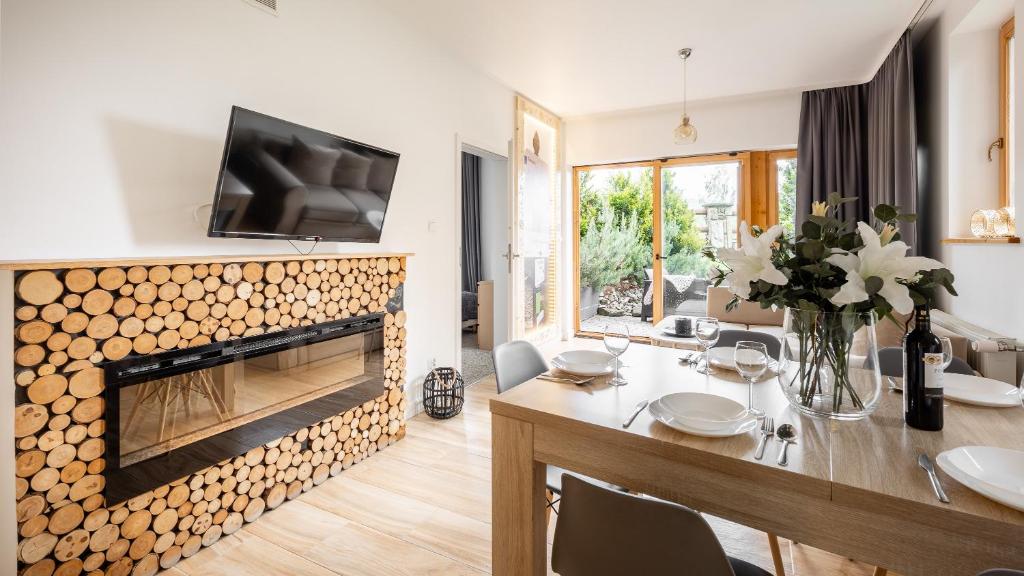 Televízia a/alebo spoločenská miestnosť v ubytovaní Aparthotel Delta Boutique