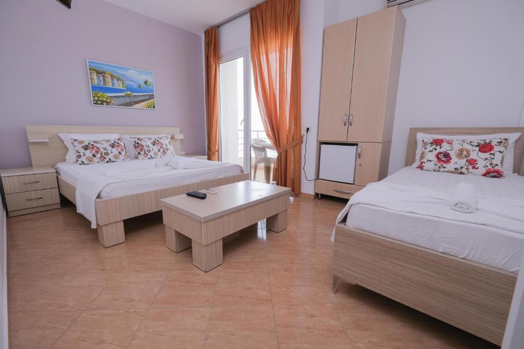 Postel nebo postele na pokoji v ubytování Sun Shine Hotel