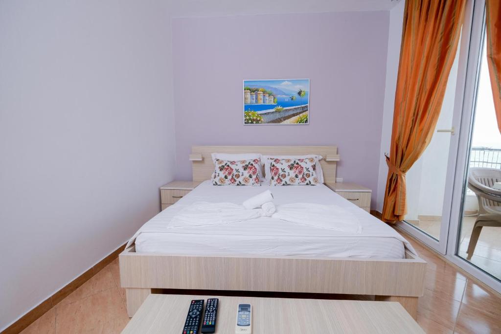 Postel nebo postele na pokoji v ubytování Sun Shine Hotel