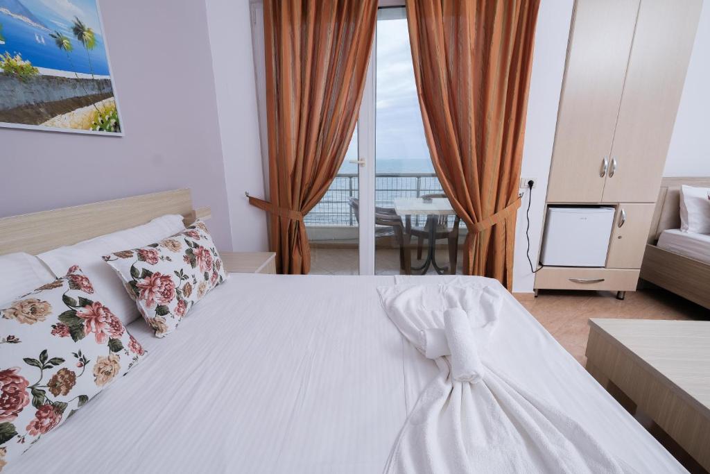 Postel nebo postele na pokoji v ubytování Sun Shine Hotel
