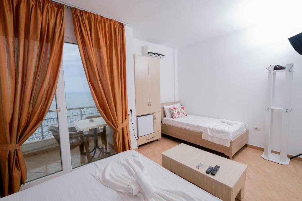 Postel nebo postele na pokoji v ubytování Sun Shine Hotel