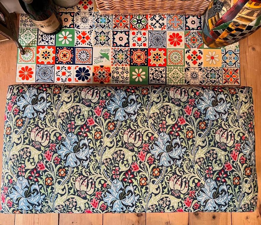a wall covered in colorful tiles on a wall at Church Retreat - A Magnificent Seaside Apartment-Award Winning in Hastings