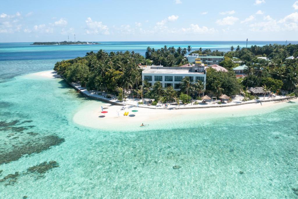 an aerial view of an island in the ocean at Plumeria Maldives in Thinadhoo