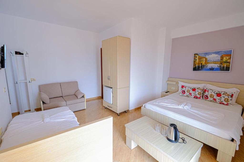 Postel nebo postele na pokoji v ubytování Sun Shine Hotel
