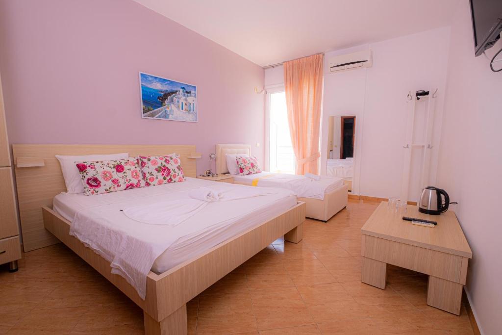 Postel nebo postele na pokoji v ubytování Sun Shine Hotel