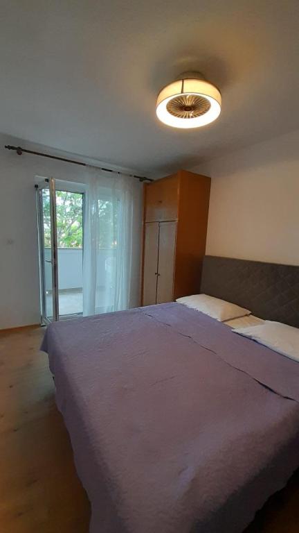 Postel nebo postele na pokoji v ubytování Apartments Anka Pag