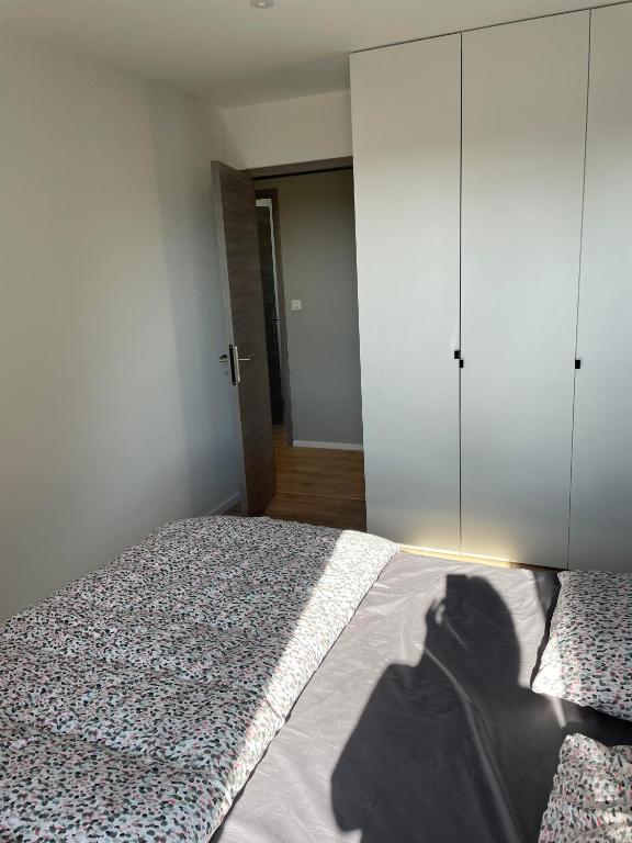 Postel nebo postele na pokoji v ubytování Superbe appartement avec vue sur la foret du Touquet Résidence les Dunes