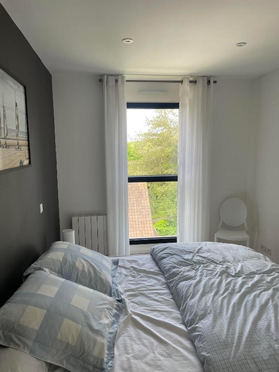 Postel nebo postele na pokoji v ubytování Superbe appartement avec vue sur la foret du Touquet Résidence les Dunes