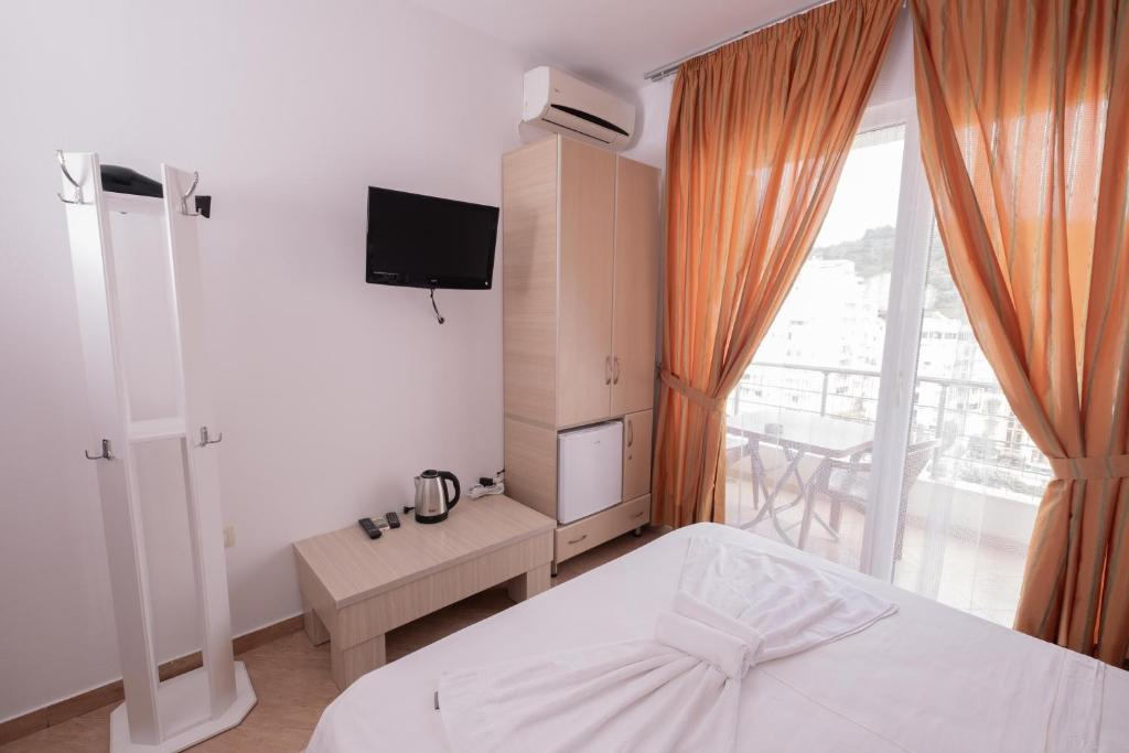 Postel nebo postele na pokoji v ubytování Sun Shine Hotel