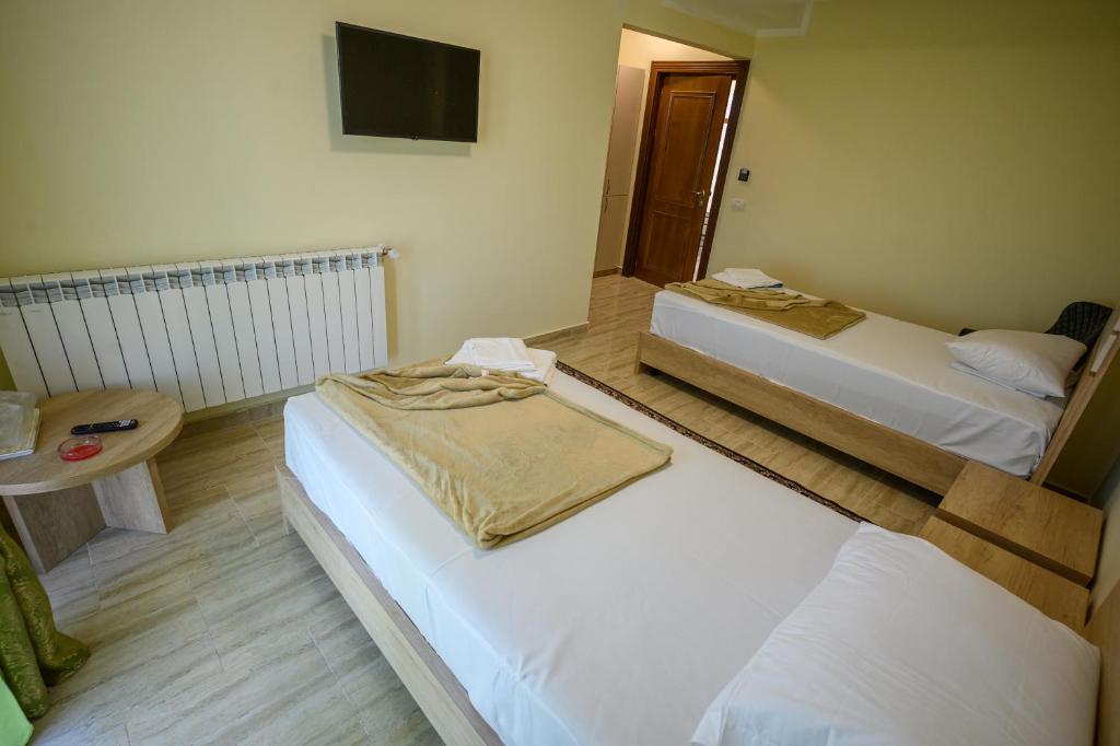 Postel nebo postele na pokoji v ubytování Hotel Austin Ov