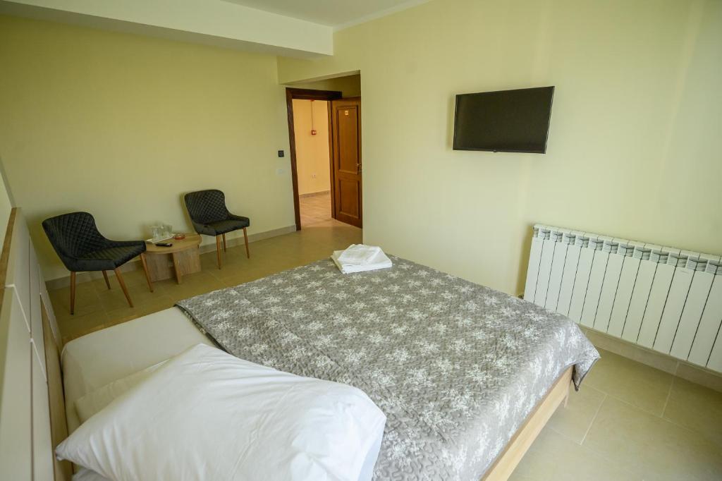 Postel nebo postele na pokoji v ubytování Hotel Austin Ov